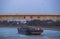 A transport vessel passing under the Rihui Bridge.