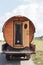 Transportation of a mobile bath. The sauna in the form of a barrel is located on the car. Transportation