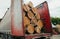 Transportation of pine logs in truck. Wood transportation