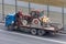 Transportation of small agricultural tractor in the back of a truck