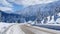 Transportation, traffic and magnificent views on mountainous roads in winter