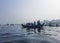 Transporting local people by small boats across the river, Commuter ferryboat in the monsoon, Boat ride in the Buriganga river.