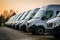 Transporting service companys fleet: Delivery vans neatly parked in rows
