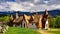 Transylvania clay castle in Romania, in the spring with mountains in the background