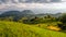 Transylvania landscape in the summer time with mountains and haystacks, mountain village in Romania