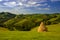 Transylvania landscape in the summer time with mountains and haystacks, mountain village in Romania