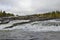 Trappstegsforsen waterfall in sweden in autumn