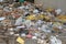 Trash bags, plastic bottles and abandoned garbage in a shed