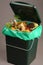 Trash bin full of organic waste
