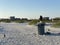 Trash can birds on the beach. crow and seagull on a garbage can on the coast of the mexico gulf. Florida