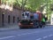 A trash collector washes the empty street during Coronavirus emergency