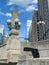 Trash of crates and empty plastic bottle discarded on the ledge opposite the sidewalk on upper Wacker Drive