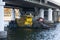 Trash skimmer boat cleaning water surface of river