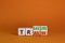 Trash to treasure symbol. Businessman turned cubes and changed the word trash to treasure. Beautiful orange table, orange