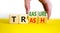 Trash to treasure symbol. Businessman turns cubes and changes the word trash to treasure. Beautiful yellow table, white background