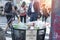 Trash waste bin on new york city street with people and copyspace.