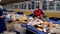 Trash workers sorting trash, garbage at a recycling plant conveyor.