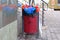 Trashcan with multicolored flowers