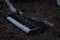 Trashed and abandoned keyboard lays alone in a field of straw, hay, and trash.