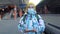 Travel 50s woman with face mask using smartphone at train station. Senior caucasian traveler checking boarding time with