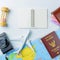 Travel accessories costumes concept for summer vacation trip. Thailand Passports, luggage, map, smartphone,camera, note pad, jean