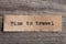 Travel and adventure concept, time to travel text on a piece of paper printed on vintage typewriter