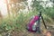 Travel and adventure concept. Traveller bag with tripod on forrest with sunlight. Picture for add text message. Backdrop for