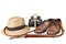 Travel and adventure concept. Vintage brown shoes with fedora hat, bullwhip, binoculars and key of life ankh isolated