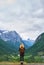 Travel adventure woman enjoying view of majestic glacial valley on exploration discover beautiful earth