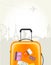 Travel agency poster with plastic suitcase and european landmark