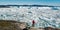 Travel in arctic landscape nature with icebergs - Greenland tourist man explorer