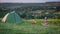 Travel with bicycle alone - young woman in the tent