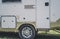 Travel camp trailer car with on the ground with grass