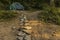 Travel and camping life style concept outside picture with stone rustic trail go to tent camp site unfocused background scenic