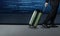 Travel Concept, Businessman with luggage walk inside airport departures terminal, Side view, Graphic about Travel Technology on t