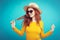 Travel concept - Close up Portrait young beautiful attractive redhair girl wtih trendy hat and sunglass smiling. Blue