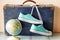 Travel concept with holiday suitcase, shoes and globe