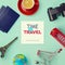 Travel concept mock up design. Objects related to travel and tourism around blank paper with retro filter effect. View from above