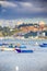 Travel Concepts. Fascinating Porto Cityscape Taken from Bridge. Colorful Fishermans Boats on Foreground