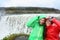 Travel couple fun by Dettifoss waterfall, Iceland