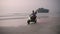 Travel couple riding motorbike on ocean sandy beach in tropical paradise at sunset. Man with girlfriend driving