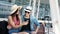 Travel. Couple Using Phone And Sitting Near Airport Terminal