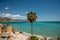 Travel destination, view on sandy beach, blue sea and mountains from Balcon de Europa in small Andalusian town Nerja with white