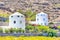 Travel Destinations. Traditional Round Greek Mill Houses on Santorini Island on Caldera Mountains