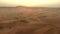 Travel, drone and man on desert sand landscape In Namibia on vacation, holiday or trip. Aerial view, freedom and peace