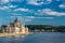 Travel and european tourism concept. Parliament and riverside in Budapest Hungary with sightseeing ships during summer sunny day w