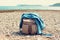 Travel female backpack with jeans shirt  on a sea coast. Fashion vacation concept