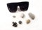 Travel flat lay. Sunglasses, stone, shell and plane. Color photo on a white background