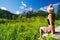 Travel, Freedom, Lifestyle concept. Young woman enjoying green nature outdoors. Amazing view on Zelenci into English means -