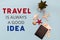 Travel is always a good idea inscription. wooden airplane, passport, banknotes and euro coins, shells on a blue background. Travel